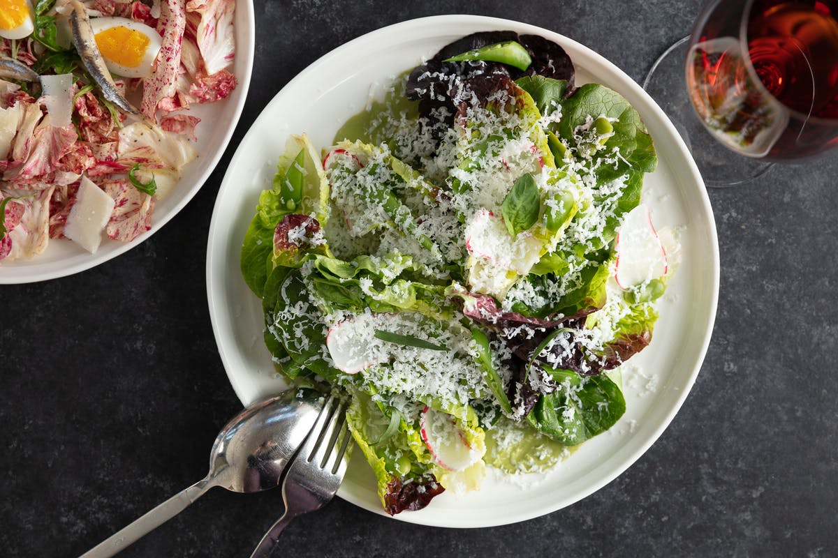 a bowl of salad on a plate